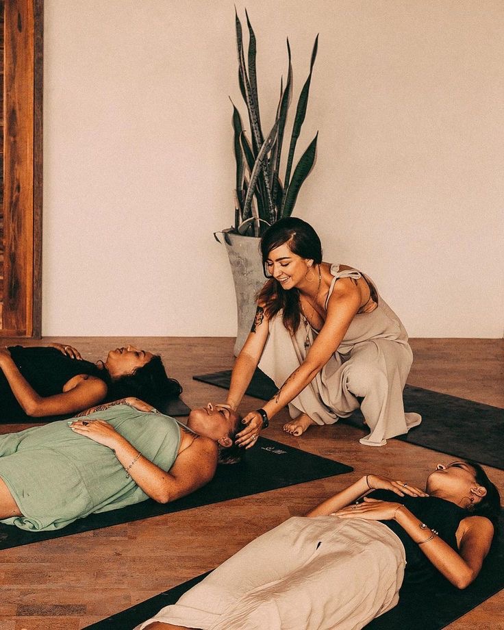 Yoga instructor with students